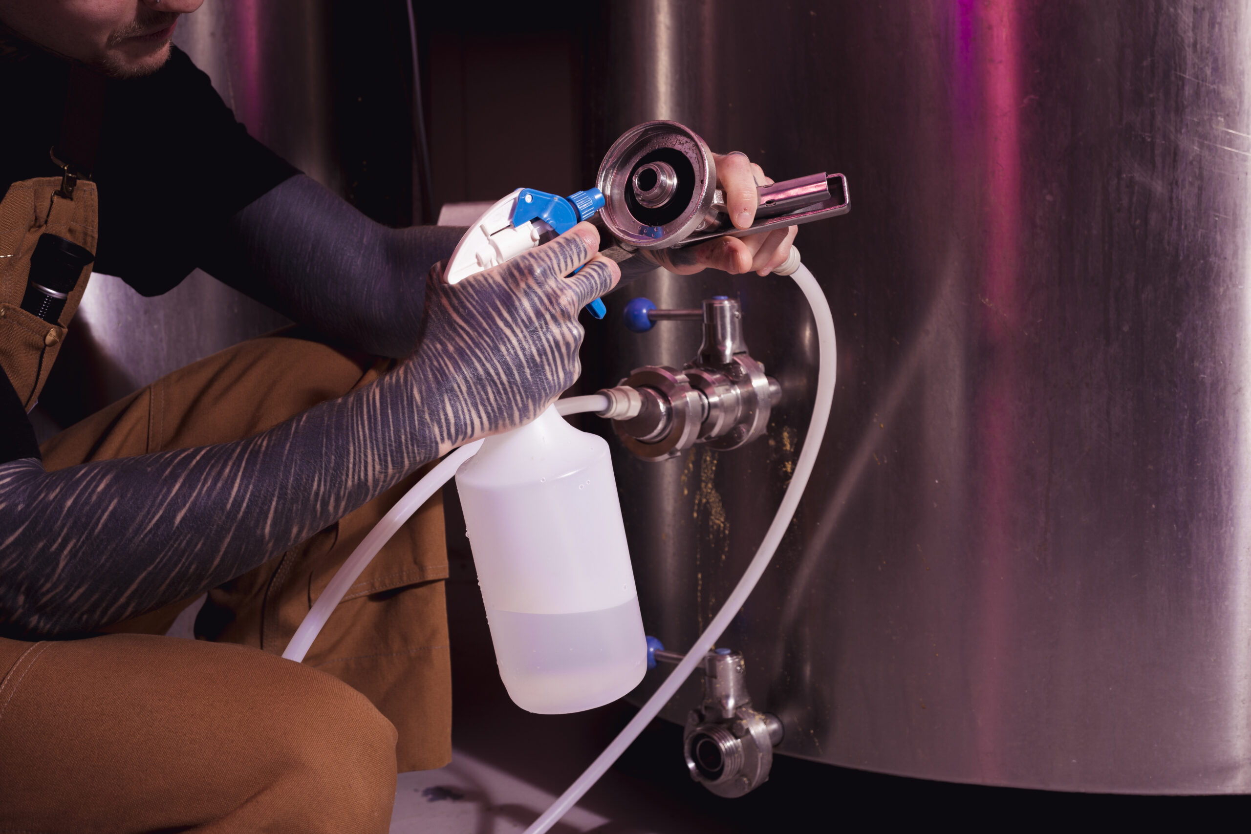 man-with-tattoos-producing-craft-beer man-with-tattoos-producing-craft-beer